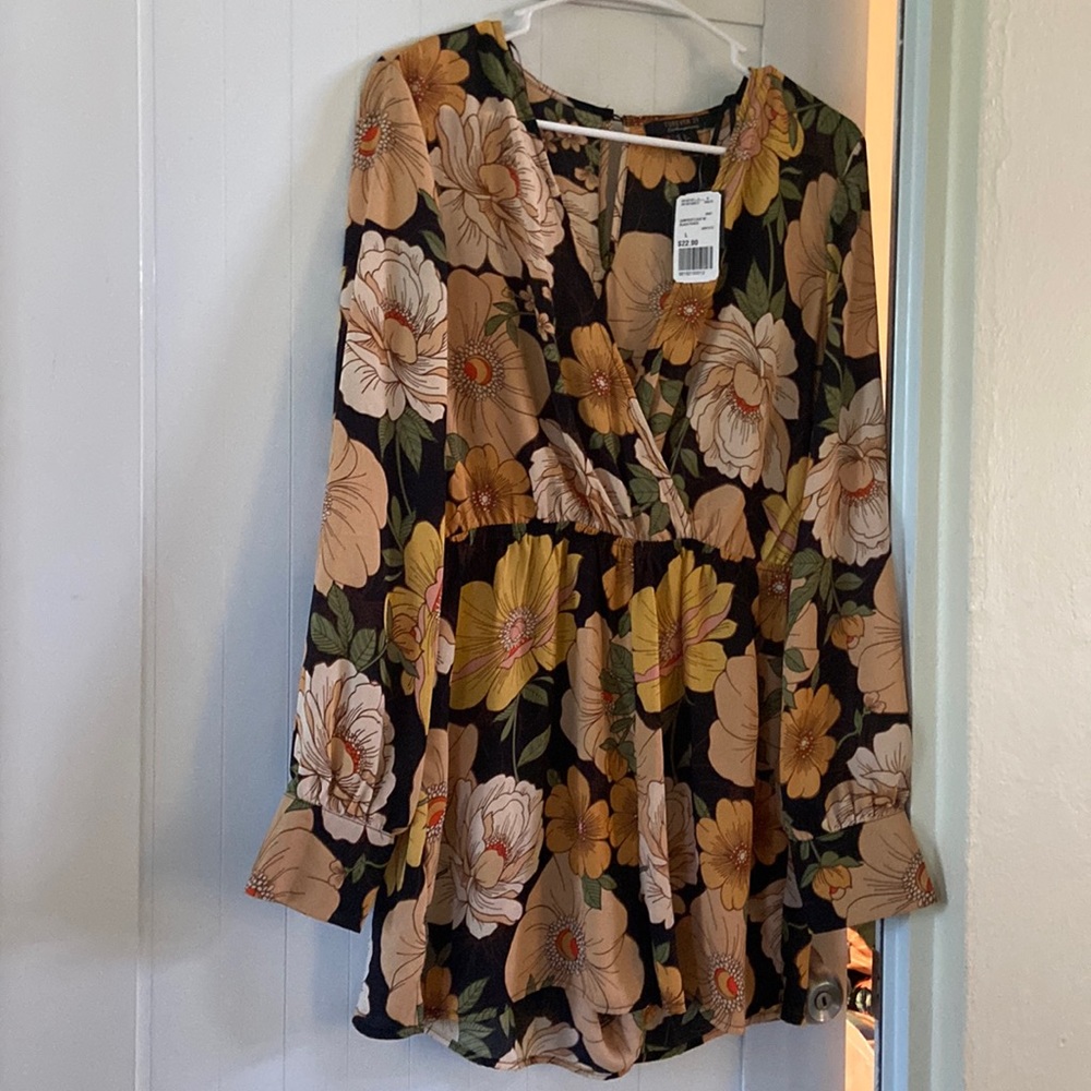 Brand new with tags. Size large short jumpsuit.